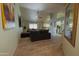 Bright, airy living room with wood-look floors, a ceiling fan and an open view to the kitchen at 6546 N 71St Ave, Glendale, AZ 85303