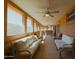 Large, covered patio with comfortable seating and ceiling fans, perfect for outdoor entertaining and relaxation at 6546 N 71St Ave, Glendale, AZ 85303