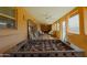 Spacious covered patio featuring a foosball table, comfortable seating, and abundant natural light at 6546 N 71St Ave, Glendale, AZ 85303