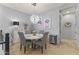 Chic dining room features a round table, patterned chairs, chandelier, and modern artwork at 6565 E Thomas Rd # 1128, Scottsdale, AZ 85251
