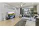 Spacious living room with hardwood floors, ample seating, and balcony overlooking the complex at 6565 E Thomas Rd # 1128, Scottsdale, AZ 85251