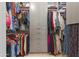 Spacious walk-in closet with custom storage solutions and organized clothing racks at 6565 E Thomas Rd # 1128, Scottsdale, AZ 85251