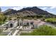 Expansive home featuring a tile roof, desert landscaping, and serene mountain backdrop at 7501 N Eucalyptus Dr, Paradise Valley, AZ 85253