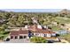 Luxury home showcasing its Spanish tile roof, large garages, backyard pool, and manicured landscaping at 7501 N Eucalyptus Dr, Paradise Valley, AZ 85253
