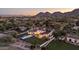 Stunning aerial view of the expansive property, showcasing the sparkling pool, lush landscaping, and impressive architecture at 7501 N Eucalyptus Dr, Paradise Valley, AZ 85253