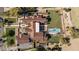 Aerial view of a luxury estate with a backyard pool, Spanish tile roof, and lush landscaping and outdoor living at 7501 N Eucalyptus Dr, Paradise Valley, AZ 85253