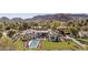 Expansive estate featuring a pool, manicured lawn, and a luxury home with a Spanish tile roof and mountain views at 7501 N Eucalyptus Dr, Paradise Valley, AZ 85253