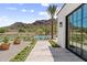 Beautiful backyard featuring a private pool, desert landscaping, and mountain views at 7501 N Eucalyptus Dr, Paradise Valley, AZ 85253