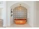 Luxurious copper soaking tub beneath elegant patterned tile and arched ceiling at 7501 N Eucalyptus Dr, Paradise Valley, AZ 85253