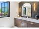 Stylish bathroom featuring a vanity with double sinks and bronze accents at 7501 N Eucalyptus Dr, Paradise Valley, AZ 85253