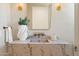 Elegant bathroom with marble countertop, decorative vessel sink, and stylish sconces at 7501 N Eucalyptus Dr, Paradise Valley, AZ 85253