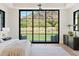 Serene main bedroom with a view of the manicured lawn and surrounding landscape at 7501 N Eucalyptus Dr, Paradise Valley, AZ 85253