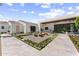 Courtyard with geometric flower beds, gravel, tile, and view of the estate and outdoor dining area at 7501 N Eucalyptus Dr, Paradise Valley, AZ 85253