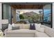Comfortable covered patio features wood ceilings with fans and views of a manicured lawn at 7501 N Eucalyptus Dr, Paradise Valley, AZ 85253