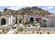Stunning home exterior showcasing a tiled roof, desert landscaping, and picturesque mountain views at 7501 N Eucalyptus Dr, Paradise Valley, AZ 85253