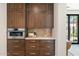 Gourmet kitchen boasts sleek stainless steel oven and custom wood cabinetry at 7501 N Eucalyptus Dr, Paradise Valley, AZ 85253