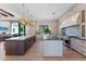 Spacious kitchen featuring oversized islands, custom cabinets, stainless steel appliances, and designer lighting at 7501 N Eucalyptus Dr, Paradise Valley, AZ 85253