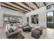 Spacious living room with wood-beamed ceilings, elegant lighting, and an open floor plan perfect for entertaining at 7501 N Eucalyptus Dr, Paradise Valley, AZ 85253
