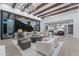 An expansive living room flows seamlessly to the outdoors, highlighting indoor-outdoor living and elegant design at 7501 N Eucalyptus Dr, Paradise Valley, AZ 85253