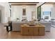 Bright living room with beamed ceilings, a modern fireplace, and comfortable, stylish furnishings at 7501 N Eucalyptus Dr, Paradise Valley, AZ 85253