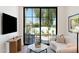 Inviting living room boasting a large window with views of the serene outdoor space and contemporary decor at 7501 N Eucalyptus Dr, Paradise Valley, AZ 85253
