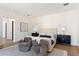 Well-lit main bedroom featuring a king bed, cozy chairs, and stylish decor at 7501 N Eucalyptus Dr, Paradise Valley, AZ 85253