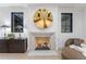 Cozy main bedroom fireplace with stylish decor elements and plenty of natural light at 7501 N Eucalyptus Dr, Paradise Valley, AZ 85253