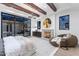 The main bedroom features beamed ceilings, fireplace, and access to a private patio at 7501 N Eucalyptus Dr, Paradise Valley, AZ 85253