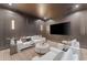 Cozy media room with a large screen TV, comfortable seating, and stylish decor at 7501 N Eucalyptus Dr, Paradise Valley, AZ 85253