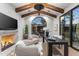 Well-lit office space with beamed ceilings, a fireplace, and modern design, perfect for remote work at 7501 N Eucalyptus Dr, Paradise Valley, AZ 85253