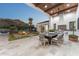 Charming outdoor dining area featuring a built-in grill, providing an elegant entertaining space at 7501 N Eucalyptus Dr, Paradise Valley, AZ 85253