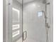 Modern shower features sleek white marble tiling, a frameless glass door, and recessed lighting at 7501 N Eucalyptus Dr, Paradise Valley, AZ 85253