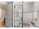 Modern shower with white tiled walls and a black framed glass enclosure at 7501 N Eucalyptus Dr, Paradise Valley, AZ 85253