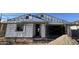 Exterior view of a home under construction, showcasing the framing and initial stages of development at 7604 W Saddlehorn Rd, Peoria, AZ 85383