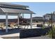 Community playground featuring play structures and picnic tables, perfect for Gathering fun and outdoor gatherings at 7604 W Saddlehorn Rd, Peoria, AZ 85383