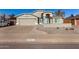 Charming single-Gathering home featuring a two-car garage, complemented by desert landscaping and a neutral color palette at 7810 W Beryl Ave, Peoria, AZ 85345