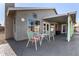 Relaxing patio with outdoor seating, overhead shade and view of the backyard at 7810 W Beryl Ave, Peoria, AZ 85345