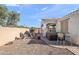 An inviting backyard features gravel, a patio, a spa, and a covered sitting area at 7936 S 7Th Way, Phoenix, AZ 85042