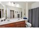 This bathroom features double sinks, decorative accents, and neutral colors at 7936 S 7Th Way, Phoenix, AZ 85042
