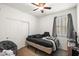 This is a simple bedroom with neutral colors and a cozy chair at 7936 S 7Th Way, Phoenix, AZ 85042