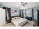 Comfortable bedroom featuring a ceiling fan and a stylish decor at 7936 S 7Th Way, Phoenix, AZ 85042
