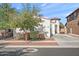 Single-Gathering home with desert landscaping, including a mature tree, a two-car garage, and a stucco exterior at 7936 S 7Th Way, Phoenix, AZ 85042