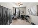 This is a well lit office area with desk, swivel chairs and wardrobe at 7936 S 7Th Way, Phoenix, AZ 85042