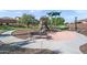 Community playground and landscaped path with a bench invite neighborly recreation at 7936 S 7Th Way, Phoenix, AZ 85042