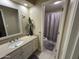 Bathroom featuring decorative mirror, vanity, and a connecting full bathroom at 839 S Westwood S -- # 169, Mesa, AZ 85210