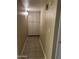 Well-lit hallway with tile flooring and built-in storage cabinets for added convenience at 839 S Westwood S -- # 169, Mesa, AZ 85210