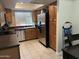 Well-lit kitchen with wood cabinets, stainless steel appliances, and black countertops at 839 S Westwood S -- # 169, Mesa, AZ 85210