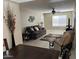 Spacious living room featuring neutral colors, a ceiling fan, and tile flooring at 839 S Westwood S -- # 169, Mesa, AZ 85210