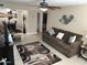 Bright living area with a cozy sofa, decorative accents, and open layout to the dining area at 839 S Westwood S -- # 169, Mesa, AZ 85210