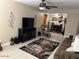 Inviting living room featuring a ceiling fan, entertainment center, and a cozy reading nook at 839 S Westwood S -- # 169, Mesa, AZ 85210